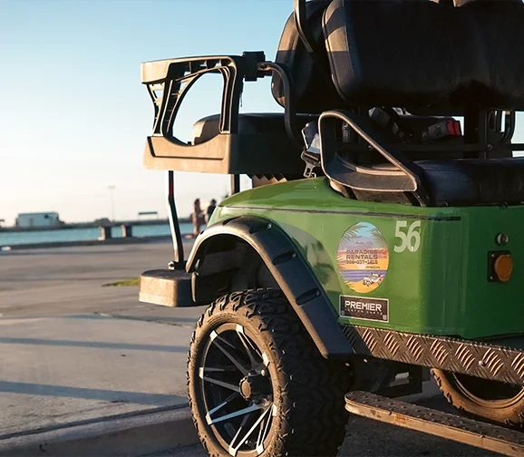 Paradise Rentals KW green electric golf cart